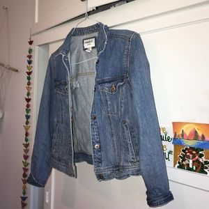 ripped faded blue jean jacket